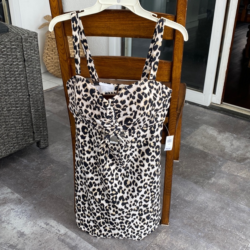 One piece swim dress. Brand new with tags, never worn.  Cheetah print.  1x